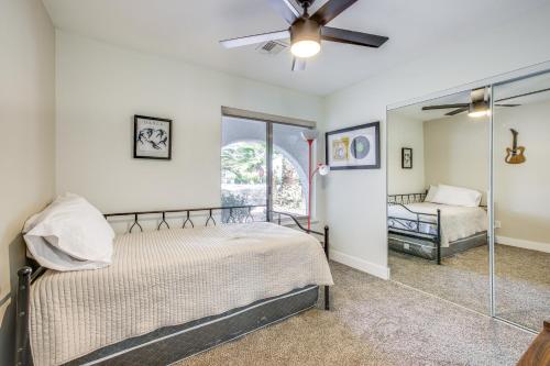 a bedroom with a bed and a ceiling fan at Las Vegas Home with Pool about 4 Mi to Las Vegas Strip! in Las Vegas