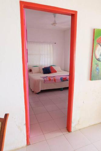 a room with a bedroom with a bed and a mirror at Cabaña en primera línea de playa en San Antero con Aire AC y 5 habitaciones in San Antero