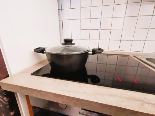 a pot on top of a stove in a kitchen at OSTIA HOME in Lido di Ostia