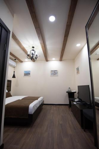 Katil atau katil-katil dalam bilik di Boutique Living Hotel