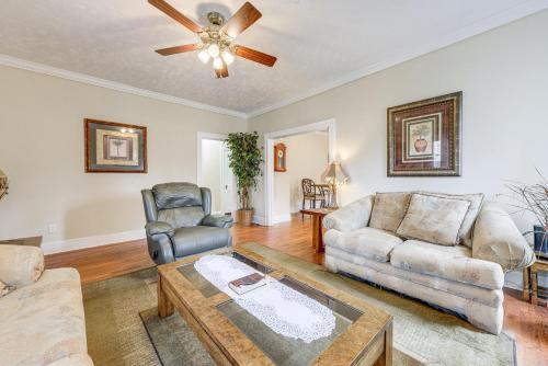 a living room with a couch and a ceiling fan at Sanford Vacation Rental about 1 Mi to Downtown! in Sanford