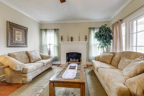 a living room with two couches and a fireplace at Sanford Vacation Rental about 1 Mi to Downtown! in Sanford