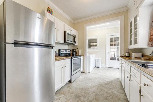 a large kitchen with a stainless steel refrigerator at Sanford Vacation Rental about 1 Mi to Downtown! in Sanford