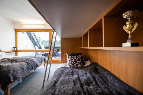 a bedroom with two beds and a trophy on the wall at Riversound in Kranjska Gora
