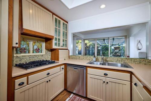 a kitchen with a sink and a stove at Family Beach house in Carlsbad