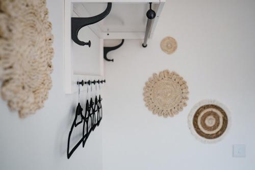 a white wall with some knick knacks on it at Leeds getaway with hot tub & gaming room in Wakefield