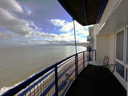 a balcony with a view of the ocean at Belle Vue in Sandown