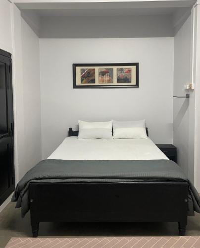 a bedroom with a large bed in a room at HeiJo's Homestay in Jowai