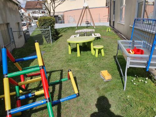 a group of childrens playground equipment in a yard at Apartement Weingarten in Weingarten