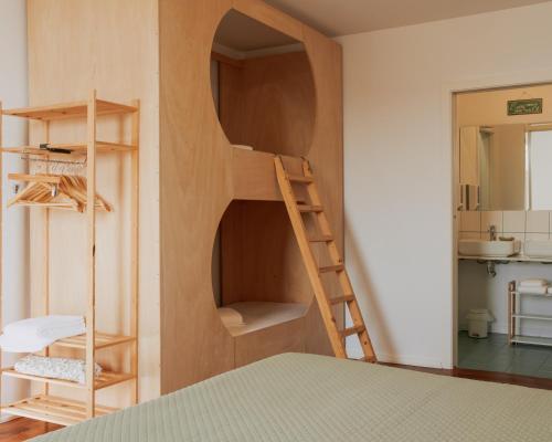 a room with a bunk bed and a ladder at Quinta da Quinhas in Vila Praia de Âncora