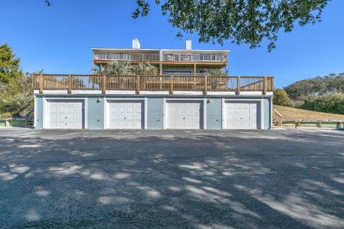 a house with a balcony on top of it at Sea-Nic View in Caswell Beach