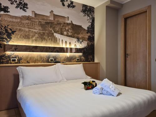 Postel nebo postele na pokoji v ubytování Hotel Cladan