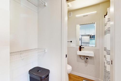 a bathroom with a toilet and a sink at Marion Place in Seattle
