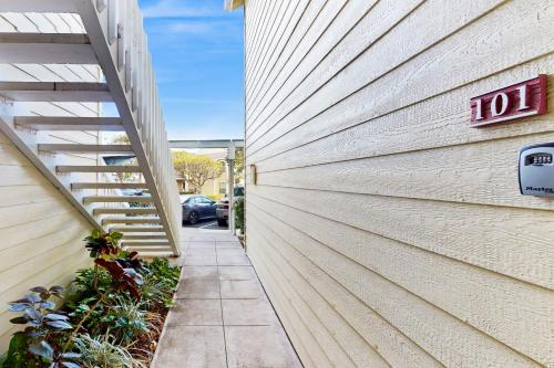 a building with a sign on the side of it at Fairway Terrace G101 in Waikoloa Village