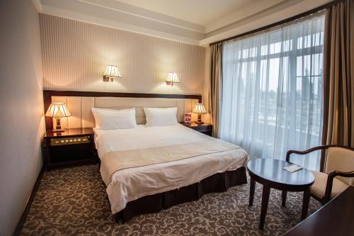 Sofievsky Posad Hotelにあるベッド