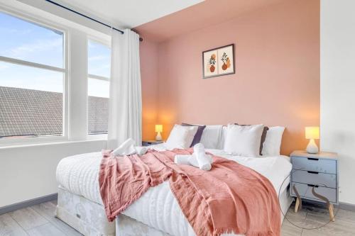 a bedroom with a large bed and a window at Bright 2D Studio in Longton Near Alton Towers with Smart TV and Self Check-In in Stoke on Trent