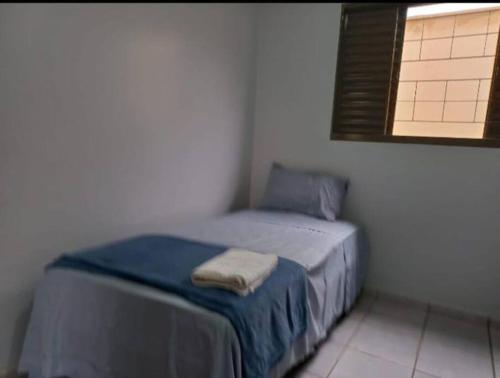 Ein Bett oder Betten in einem Zimmer der Unterkunft Casa da Iná! Com piscina e churrasqueira!