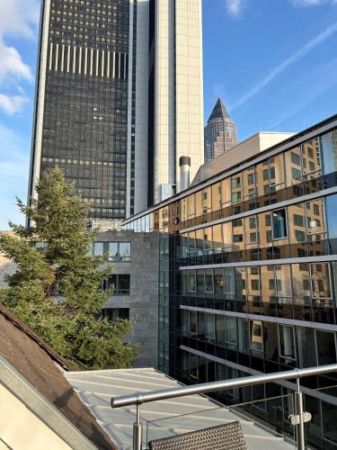 a view of some tall buildings in a city at Villa Hotel Frankfurt by MZ HotelCollection in Frankfurt
