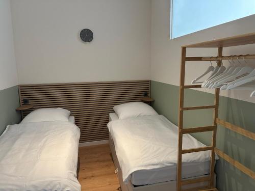 a room with two bunk beds and a ladder at Luxury in center of Berlin Mitte in Berlin