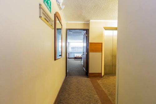 a hallway of an office building with at Akros Galapagos Suite in Quito