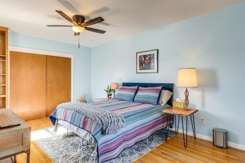 a bedroom with a bed and a ceiling fan at 7 Mi to Denver Inviting Aurora Home with Yard! in Aurora