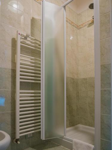 a shower with a glass door in a bathroom at B&B Villa Erika in Lugo
