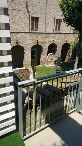 a building with a fence in front of it at nel centro storico casa vacanze I Mughetti in Citta' Sant'Angelo