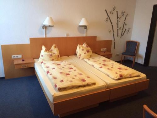 Postel nebo postele na pokoji v ubytování Hotel Am Salzberg
