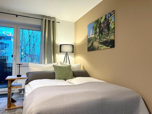 Ένα ή περισσότερα κρεβάτια σε δωμάτιο στο Seehaus Aachblick, Exklusive Appartements und Ferienwohnungen