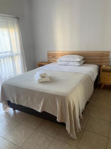 Una cama o camas en una habitación de Departamento LUZ San Nicolás