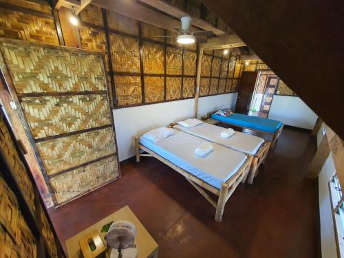 Postel nebo postele na pokoji v ubytování Coleto Siargao