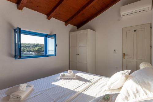 a bedroom with a bed with towels on it at Otus in Kraj