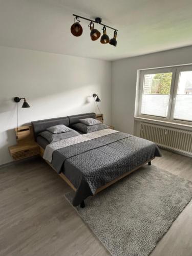 a bedroom with a large bed and a window at Ferienwohnung LauterWein in Bernkastel-Kues