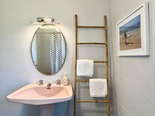 a bathroom with a sink and a mirror at Camino del Soplao -zona Santillana del Mar- in Reocín