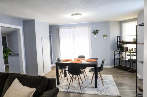 a living room with a table and chairs at The Main Nest - Near City Center in Klamath Falls