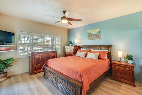 a bedroom with a bed and a ceiling fan at Palm Desert Condo with Patio and Community Perks! in Palm Desert