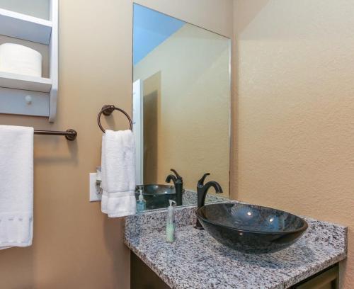 a bathroom with a sink and a large mirror at House# 60 Point of View (pet friendly) in Centre