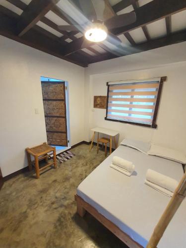 Postel nebo postele na pokoji v ubytování Coleto Siargao