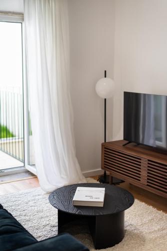 TV a/nebo společenská místnost v ubytování The Haus - Alegria
