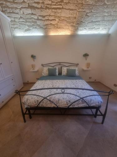 מיטה או מיטות בחדר ב-Domàtio melissa