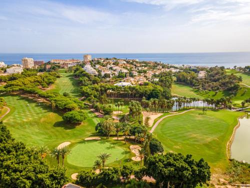 an aerial view of the golf course at the resort at Wonderful Golf & Beach Apartment with front Seaview and Pool in Benalmádena