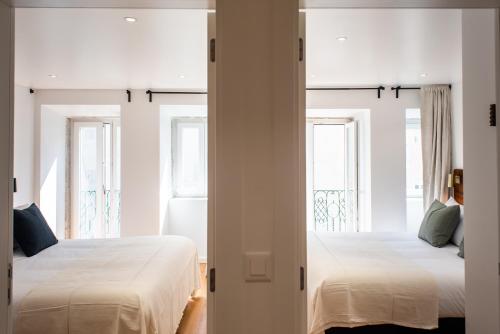 Postel nebo postele na pokoji v ubytování The Haus - Alegria