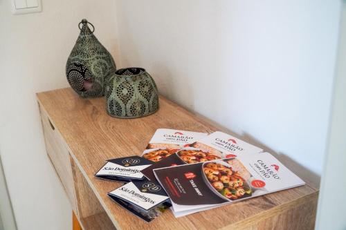a wooden table with some food items on it at Villa Marrachinho in Albufeira