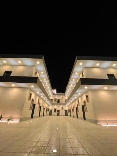 a large building with a long hallway at night at Dareen Boutique in Abha