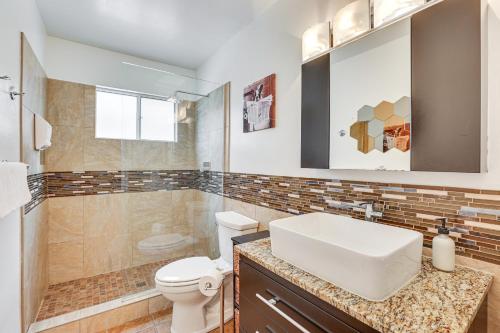 een badkamer met een witte wastafel en een toilet bij Old Town Scottsdale Retreat with Pool Access! in Scottsdale