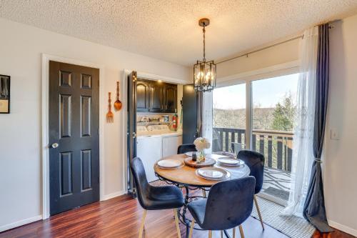 a kitchen and dining room with a table and chairs at Holiday Island Escape with Panoramic Lake Views in Holiday Island