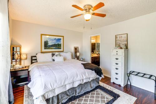 a bedroom with a bed and a ceiling fan at Holiday Island Escape with Panoramic Lake Views in Holiday Island