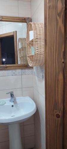 a bathroom with a sink and a mirror at Golemi kamik Pirot Vlasi 2 in Pirot