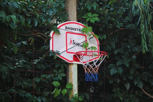 a basketball hoop attached to a fence at Apartment Hiža 38 in Mala Subotica