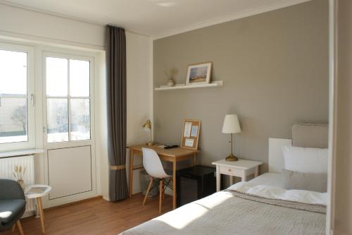 Postel nebo postele na pokoji v ubytování Hotel Strandly Skagen